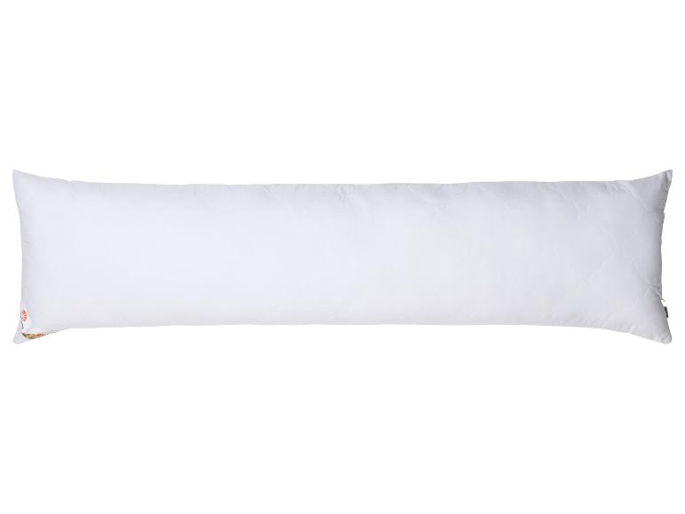 Ein großes weißes Kissen mit Reißverschluss.