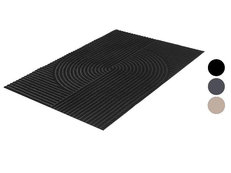 Schwarze rechteckige Fußmatte mit geometrischem Muster aus Linien und Halbkreisen.