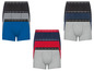 Sechs Paar Boxershorts in verschiedenen Farben und Mustern.