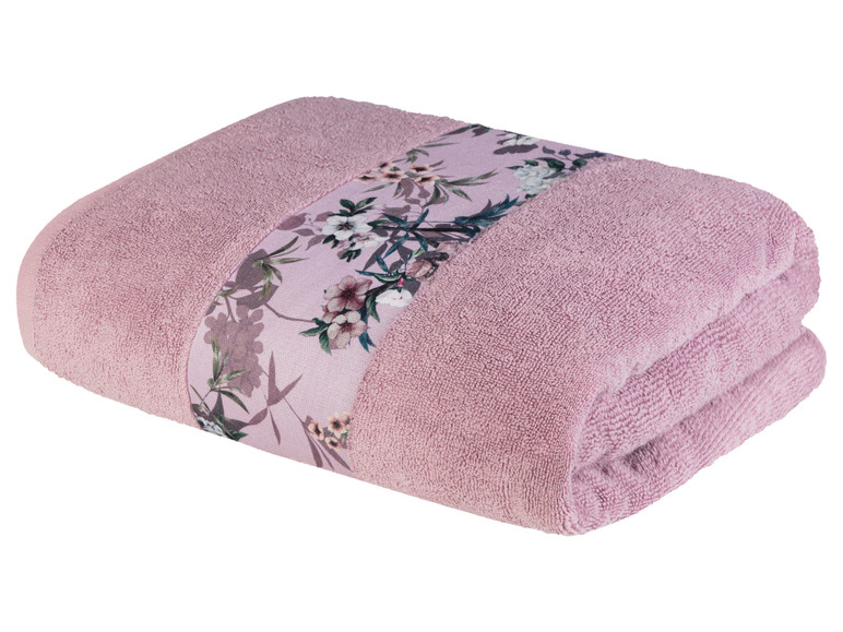 Ein rosa Handtuch mit Blumenmuster.
