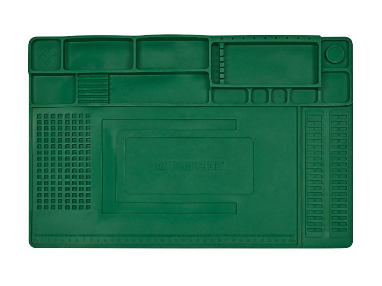 Grüne Parkside Arbeitsmatte mit Fächern und Lineal.