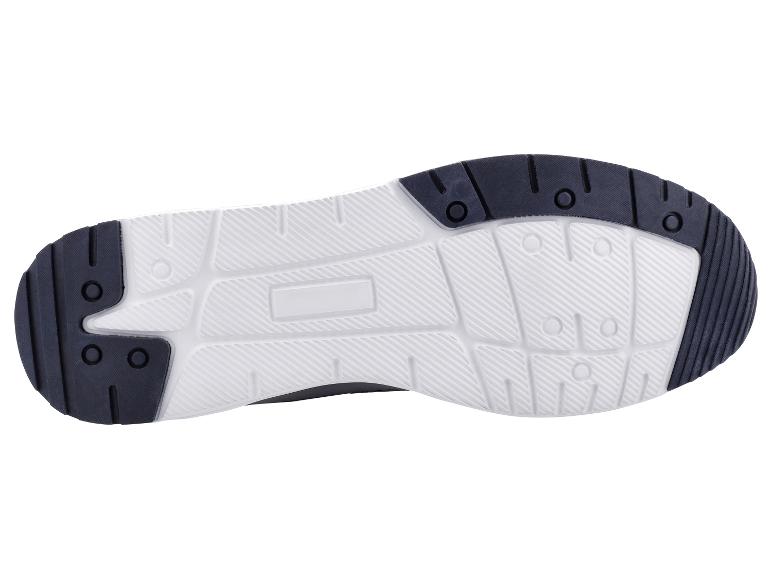 Weiße und schwarze Sportschuhsohle mit rutschfestem Muster