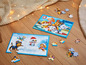 Zwei Paw Patrol Puzzle mit Winterthema, eines mit Schneemann und das andere mit allen Welpen.