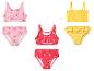 Kinder-Bikini-Sets: rosa mit Kirschen, rot mit Erdbeeren und gelb mit Rüschen.