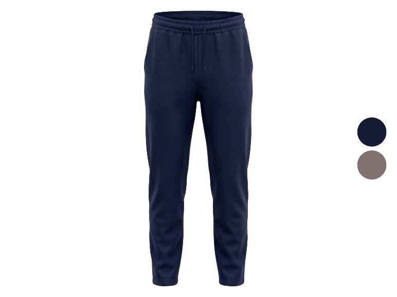 Dunkelblaue Jogginghose mit Kordelzug und Taschen, mit Farboption in Grau.