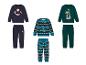 Drei Kinder-Sweatshirt- und Hosen-Sets mit Weihnachtsmotiven.