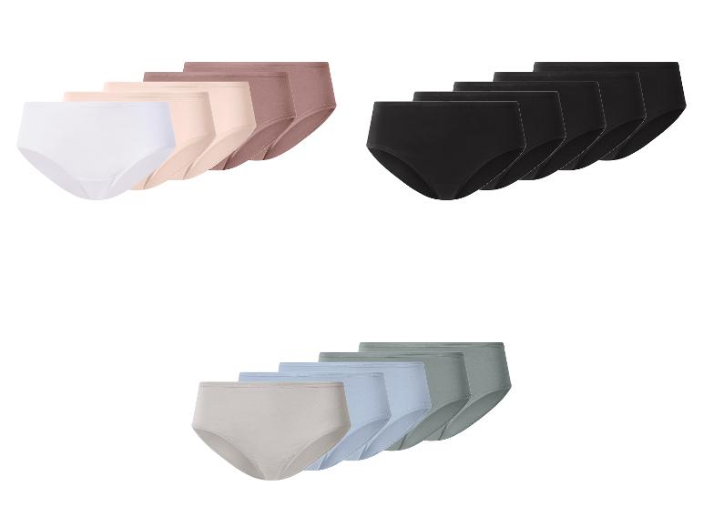 Drei Packungen Damenunterhosen in Weiß, Schwarz und neutralen Farben.