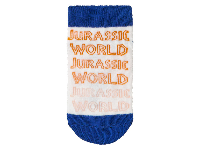 Ein Paar weiße Socken mit blauen Akzenten und einem 'Jurassic World'-Druck.