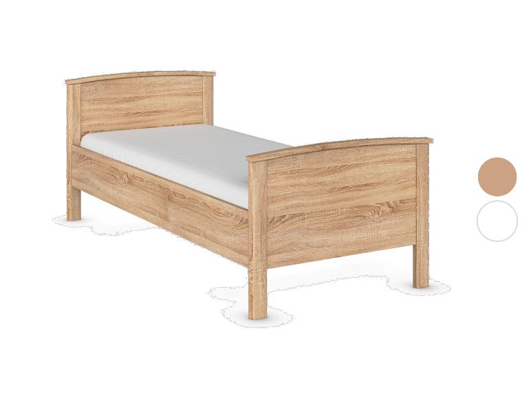 Einzelbett aus hellem Holz mit weißer Matratze