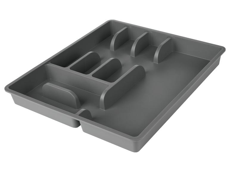 Dunkelgrauer Schubladenorganizer mit Fächern.