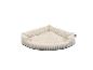 Beige Cord-Hundebett in Eckform.
