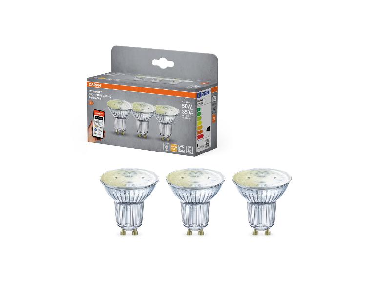 Drei dimmbare smarte GU10 LED-Spots in Verpackung, mit Spezifikationen und App-Integration.