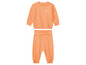 Ein orangefarbenes Babyset mit Sweatshirt und Hose