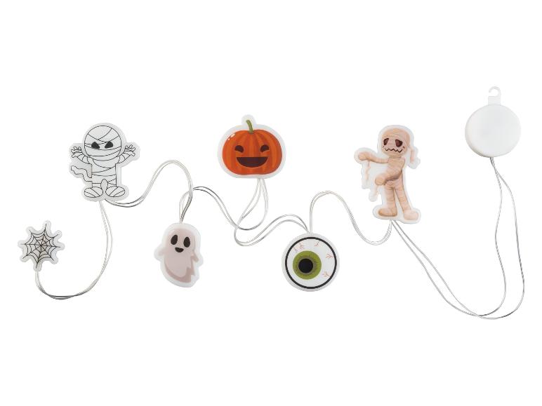Halloween-Dekorationsset mit Mumien, Kürbis, Geist, Spinnennetz und Augapfel.