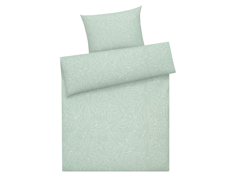 Bettwäsche mit tropischem Blättermuster.