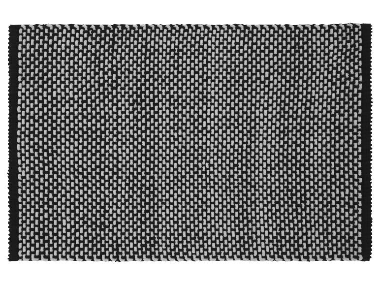 Geometrischer schwarz-weißer Designteppich.