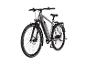 Graues elektrisches Trekkingrad mit Mountainbike-Reifen und Gepäckträger.