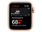 Eine goldene Apple Watch mit Herzfrequenzmessung, die 68 BPM anzeigt.