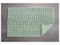 Hellgrüne, strukturierte Badematte.