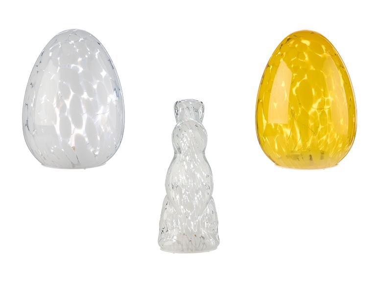 Zwei eiförmige und eine hasenförmige Glas-Dekorationslampe.