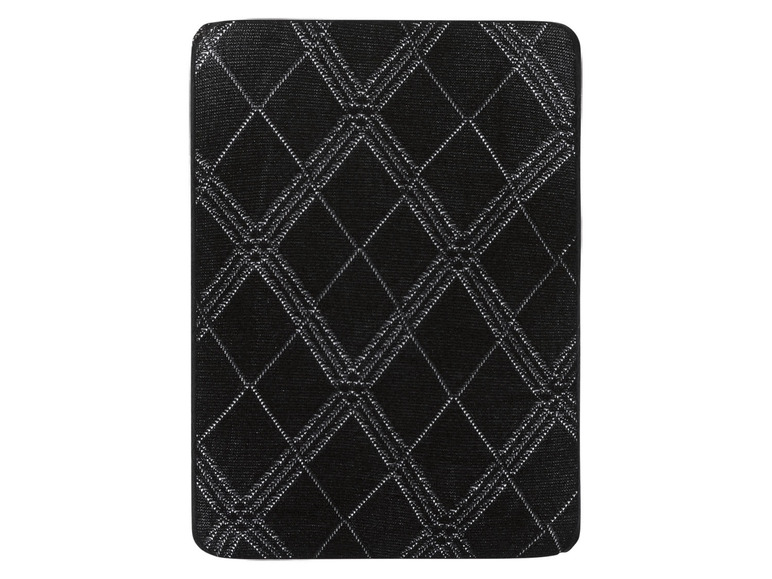 Eine schwarze Matratze mit einem Diamantenmuster.