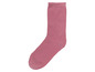 Eine rosa Socke mit einem gekräuselten Rand.