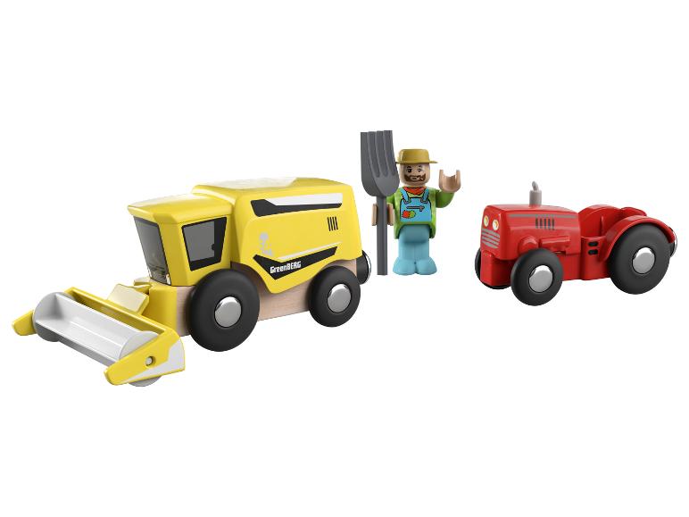 Eine Greenberg Mähdrescher, ein roter Traktor und ein Bauer mit einer Heugabel.