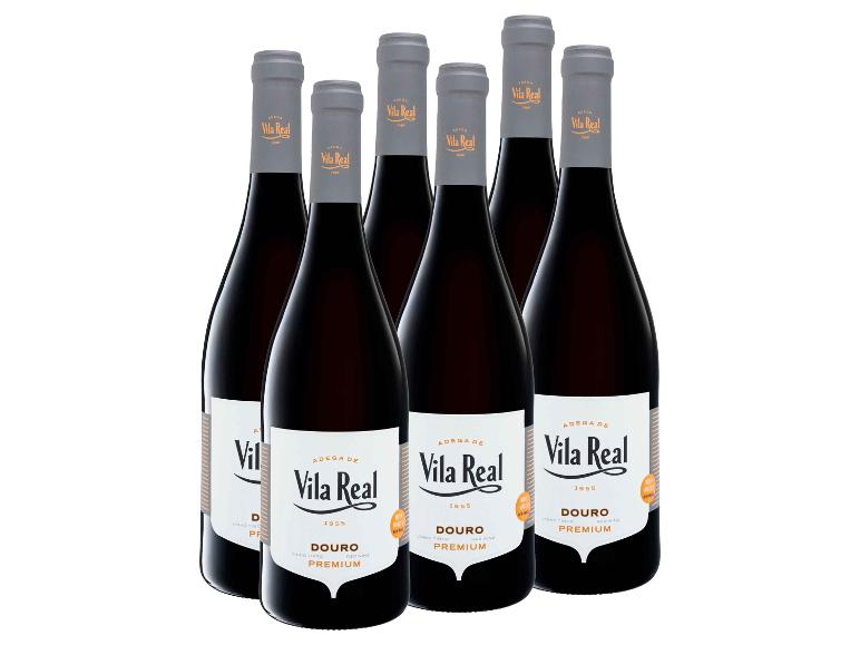 Sechs Flaschen Rotwein mit weißen Etiketten, die „Douro Premium“ zeigen.