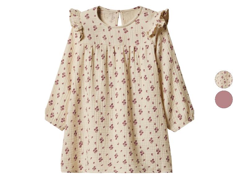 Beiges langärmeliges Kinderkleid mit lila Blumenmuster.