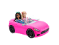 Rosa Spielzeug-Cabriolet mit zwei Puppen