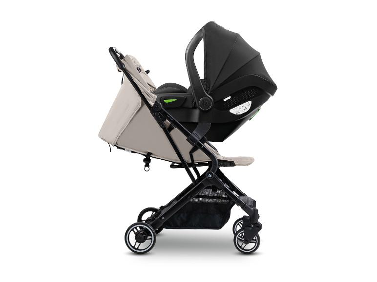 Beiger Kinderwagen mit schwarzem Autositz