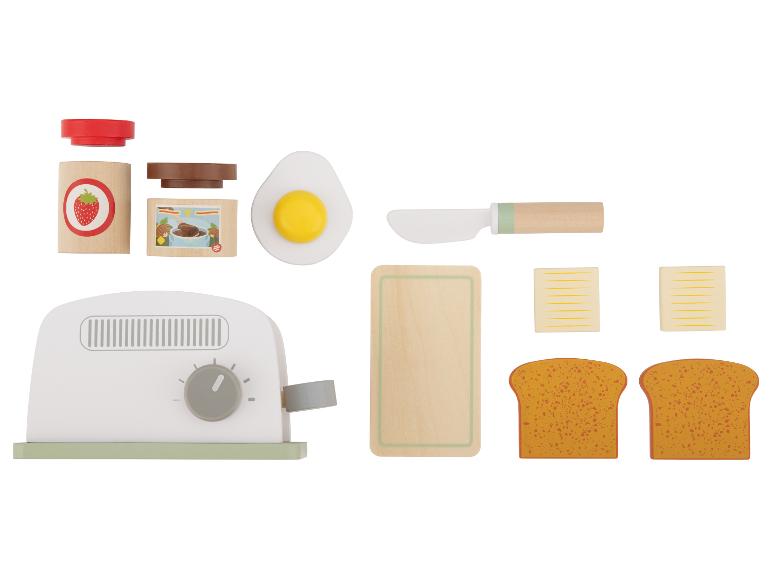 Holzspielzeug für das Frühstück, darunter Toaster, Toast, Butter, Ei und Marmelade.
