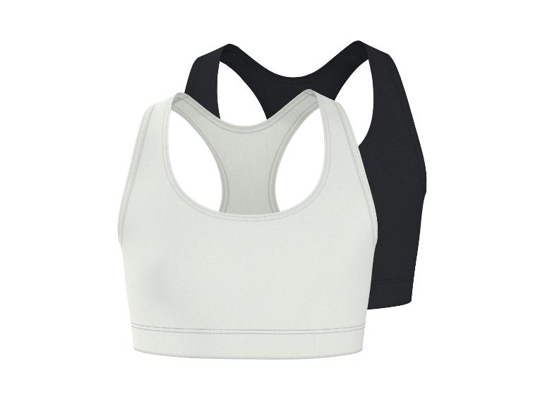 Zwei Sport-BHs, einer weiß und einer schwarz, mit Racerback-Design.