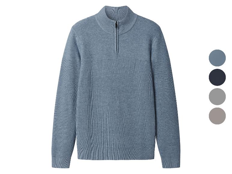 Blauer Strickpullover mit kurzem Reißverschluss und Farbpalette.