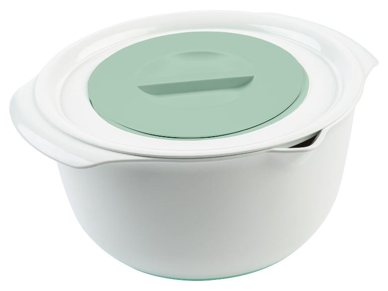 Eine weiße Rührschüssel mit einem hellgrünen Deckel.
