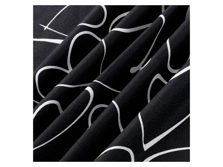 Schwarzes Textil mit weißen, abstrakten Linien.