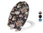 Weiße Toilettensitz mit Blumenmuster.
