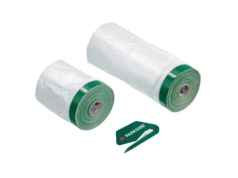 Zwei Rollen weißer Abdeckfolie und ein grüner Parkside-Schneider