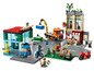 LEGO City Set mit einer Tankstelle, einer Pizzeria und einem Feuerwehrwagen.