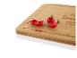 Bambus-Schneidebrett mit Kirschtomaten und dem Spruch 'Home Sweet Home'