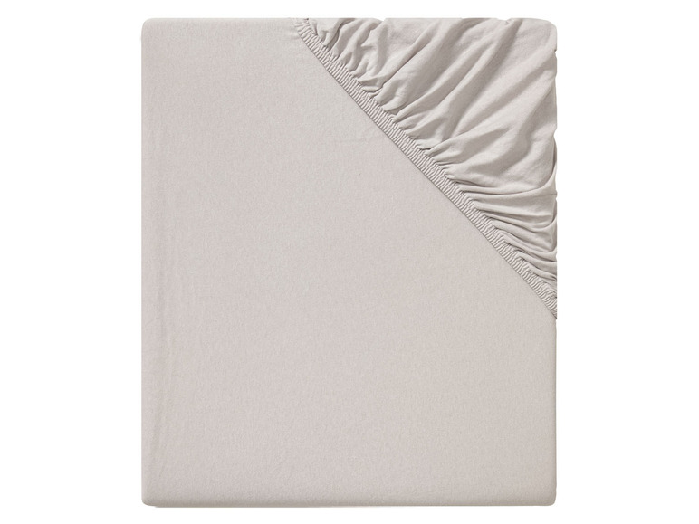 Beige Spannbettlaken für eine Matratze.