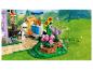LEGO Friends Set mit Imkerin, Bienenstöcken und Blumen in grüner Landschaft.