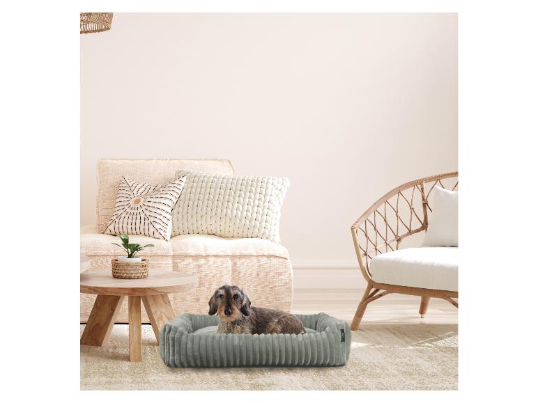 Graues Cord-Hundebett im Boho-Stil.