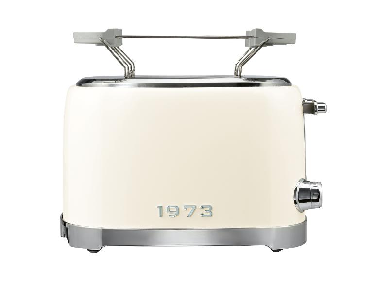 Cremefarbener Retro-Toaster mit Chromdetails und der Aufschrift „1973“ auf der Vorderseite.