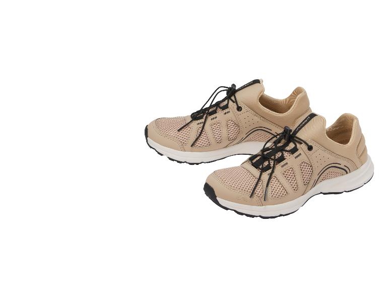 Paar beige und schwarze Mesh-Sportschuhe mit elastischen Schnürsenkeln.