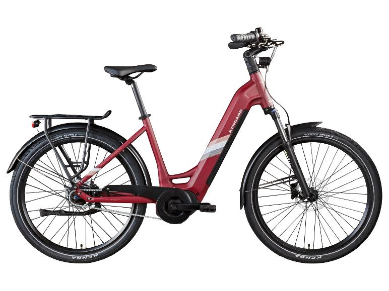 Rotes E-Citybike mit Tiefeinsteigerrahmen, Gepäckträger und Schutzblechen.