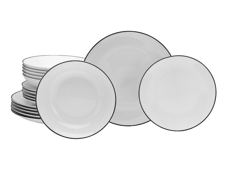 Set weiße Teller mit schwarzen Rändern, gestapelt und angeordnet