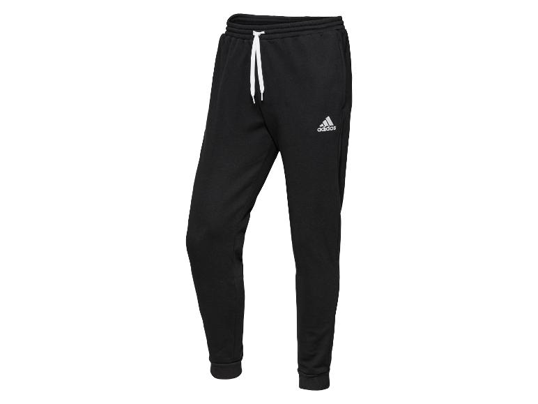 Schwarze Adidas Jogginghose mit weißem Kordelzug.