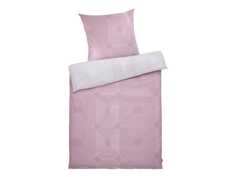 Ein rosafarbener Bettbezug mit einem weißen geometrischen Muster.