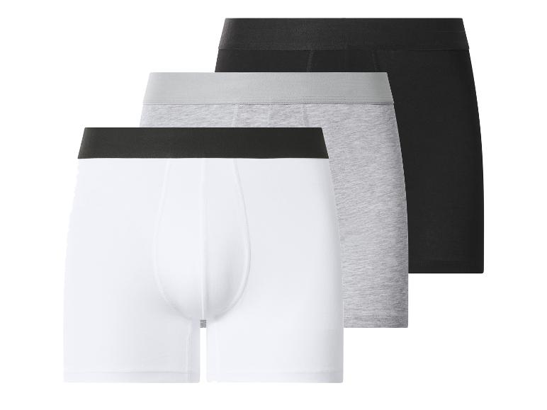 Drei Herren-Boxershorts: weiß, grau und schwarz.